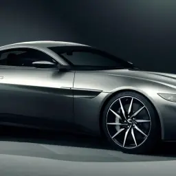 Srebrny Aston Martin DB10, sportowy samochód o aerodynamicznej sylwetce, prezentuje swoje eleganckie linie i felgi.